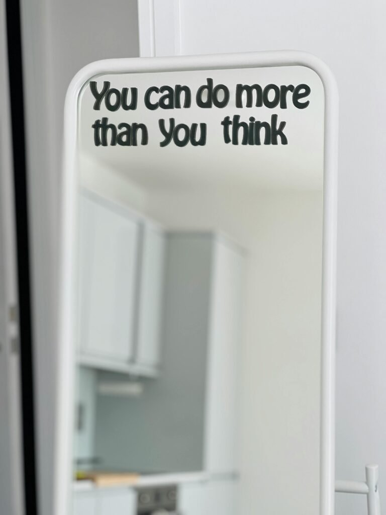 Reflective motivational quote in a modern kitchen setting.